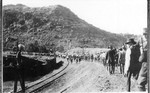 Strikers being forced to march by gunpoint from Old Bisbee to the Warren Ballpark during the Bisbee Deportation, July 12, 1917. The men with rifles are members of the Loyalty League who were deputized by Sheriff Wheeler. These men came from Bisbee and Douglas.