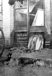 The Queen Laundry flooded with water coming out of the establishment and gushing into the street. It was located at the head of Brewery Gulch in Bisbee. J.A. Beaton and Sons were the proprietors.