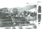 A view of the manager's home. First occupant: Lewis Williams. Second occupant: Ben Williams. Third: Walter Douglas (1902). Notice the Copper Queen Hotel is not in this photo, so that dates this photo prior to 1902. Note the Copper Queen Library at far right, built in 1904. The Williams/Douglas House on far left is where present day Bisbee Y is located.