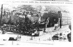 The Phelps Dodge Copper Queen Company store after the fire on September 23, 1938. The Phelps Dodge Warehouse is the four story building in the background.