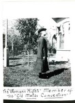 Actress in costume playing the suffragette The Woman's Rights in the play The Old Maids Convention. She is standing in a garden with two-piece suit and hat. The Old Maids Convention or called the Spinsters' Convention was a popular play prior to WWI. Photo taken in the garden of the Young Women's Christian Association, YWCA, located on Howell Avenue in Bisbee.