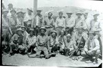 Picture of the posse that captured Martinez and Silvas who shot and killed a couple. They were caught and sentenced to prison in Florence but escaped on the way. They were recaptured by this posse. The 6th man from the right in the back row is Martinez and the man on his left is Silvas. The next man is unidentified and the man on his left is Bird Yoas. The man at the end of the back row is Herbert Wood. In the front row, left to right, are All Caverlan, Lon Parker, unknown, unknown, Shorty Holcum, unknown, unknown, unknown, Jay Lome (later sheriff).