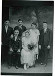 Studio portrait of a wedding party, circa 1920s. Back row, left to right: Lazo Bugen, Archie Bugen, Edie Papen (bridesmaid), and Sam Sorich (best man). Front: Chris Bugen (groom) , Mamie Milutinovich (bride).