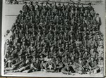 Photograph of a large group of miners posing with a sign that reads: No accidents here since May 18, 1926. They are Phelps Dodge employees, Southwest Mine Div. 1. A note on the ID sheet says See Copper Queen Bulletin May 1926 which makes it unclear if the photo was taken in 1926 or at a later date and 1926 was the last accident.