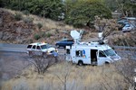 The KVOA Channel 4 Tucson News van, parked alongside Highway 80, covering the Thirty Moon Fire on March 20, 2008. A Cochise County Sheriff's SUV is parked behind the news van.