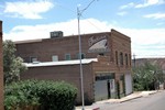 The old Brophy building on Erie Street in Lowell. Dump Number Seven is visible in the background. Wittig Once Upon a Mine collection.
